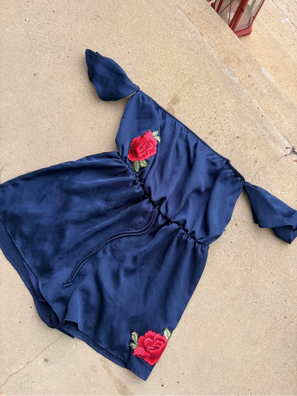 Everly Navy Romper with Rose Embellishment